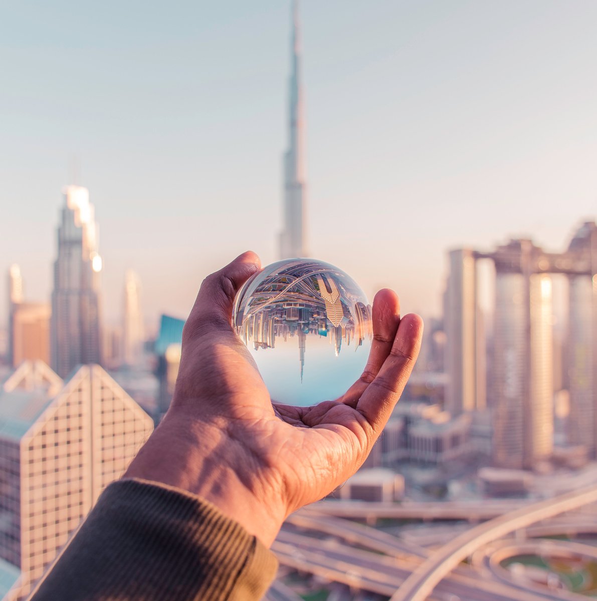 Person Holding Clear Glass Ball